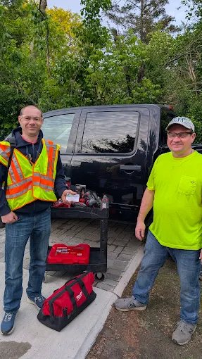 The Handyman Manlius team with their work truck and tools